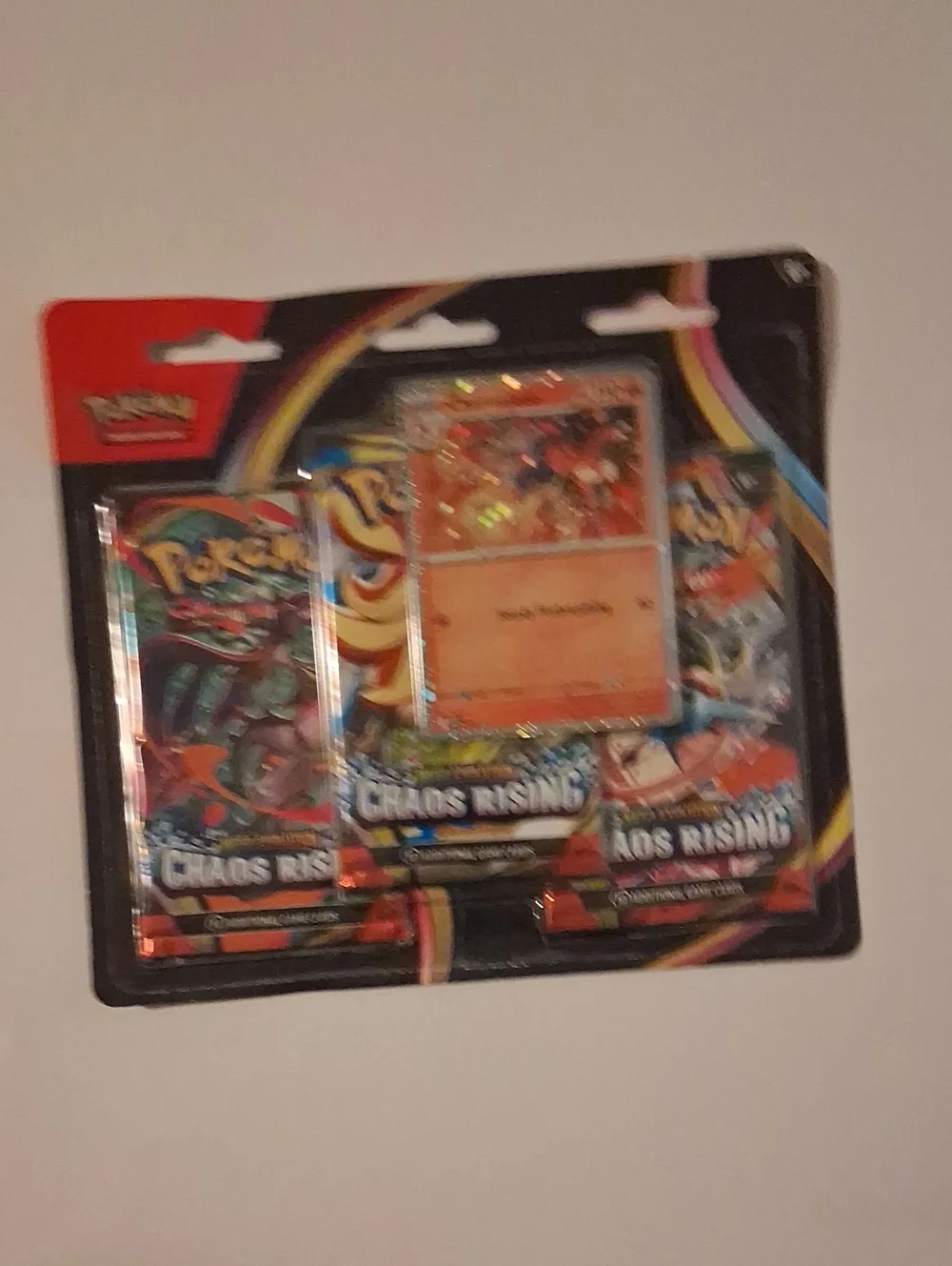 Pokémon Chaos Rising Booster Pack Trio with Holo Promo Card - Red/Orange/Black